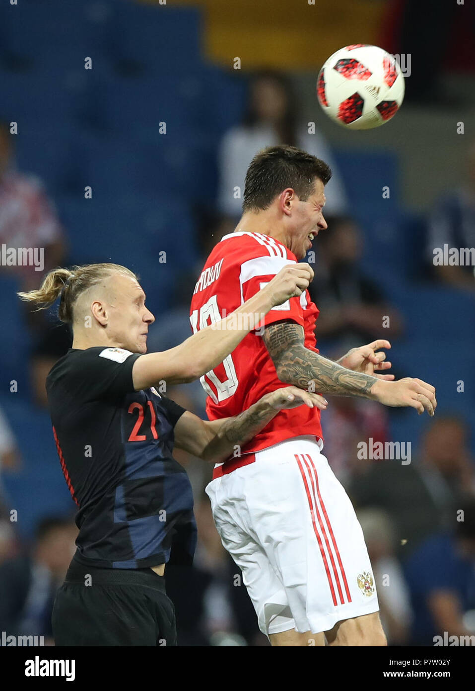 Sochi, Russia. 7th July, 2018. Fedor Smolov (R) of Russia competes for a header with Domagoj Vida of Croatia during the 2018 FIFA World Cup quarter-final match between Russia and Croatia in Sochi, Russia, July 7, 2018. Credit: Wu Zhuang/Xinhua/Alamy Live News Stock Photo