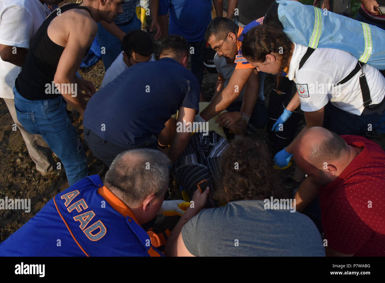 Ankara. 8th July, 2018. Rescuers help an injured passenger after a train derailed in Tekirdag, northwestern Turkey, July 8, 2018. At least 10 people were killed and 73 others were injured when a commuter train derailed on Sunday in Turkey's northwestern Tekirdag province, local media reported. Credit: Xinhua/Alamy Live News Stock Photo
