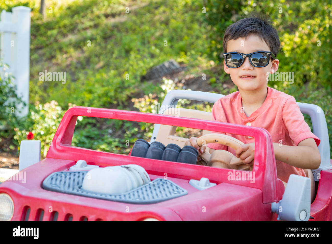 Young Mixed Race Chinese and Caucasian Boy Wearing Sunglasses Playing ...