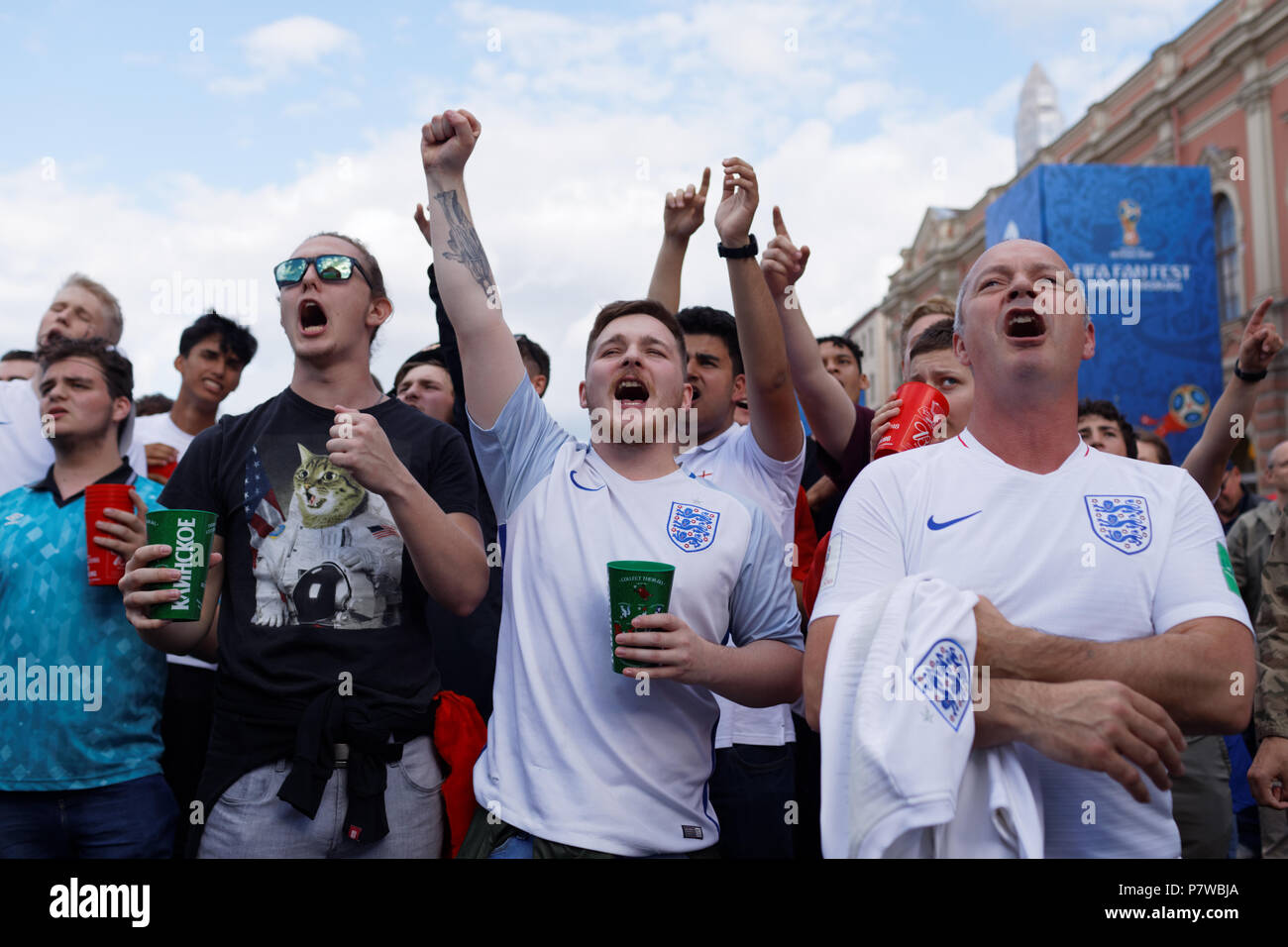 St. Petersburg, Russia - July 7, 2018: English football fans at FIFA Fan Fest in Saint Petersburg watch the quarterfinal match of FIFA World Cup 2018  Stock Photo