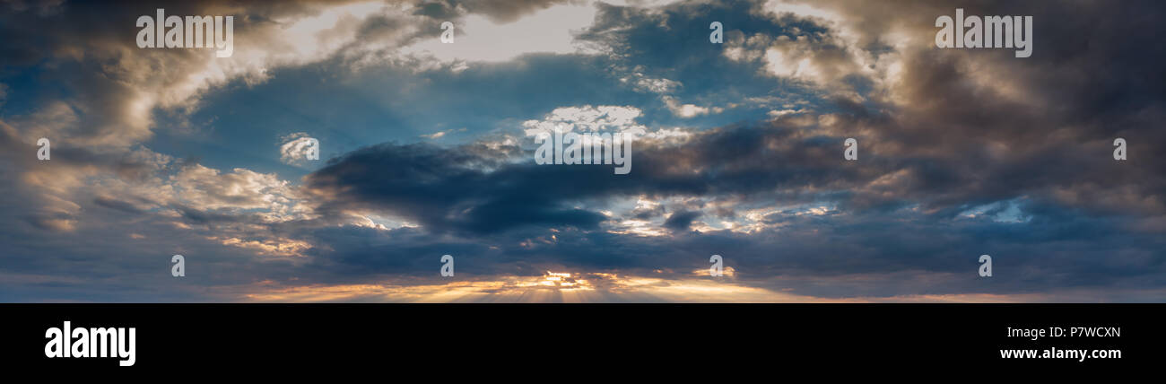 Blue and orange Sunset sky with clouds Stock Photo - Alamy