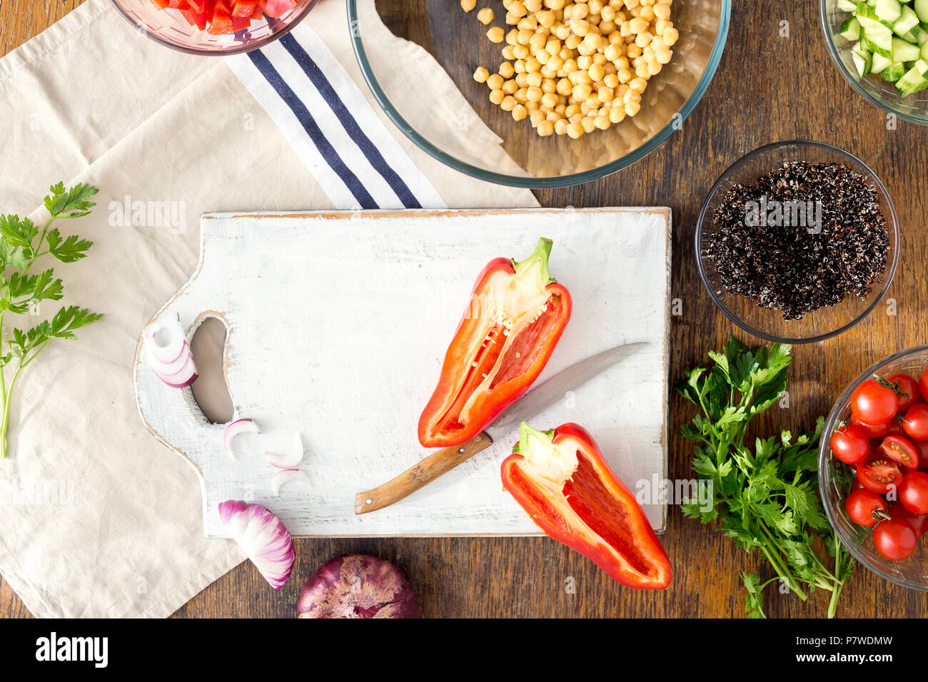 Ingredients for cooking vegetarian salad with chickpeas, black quinoa and vegetables on wooden table, top view. Superfood concept Stock Photo