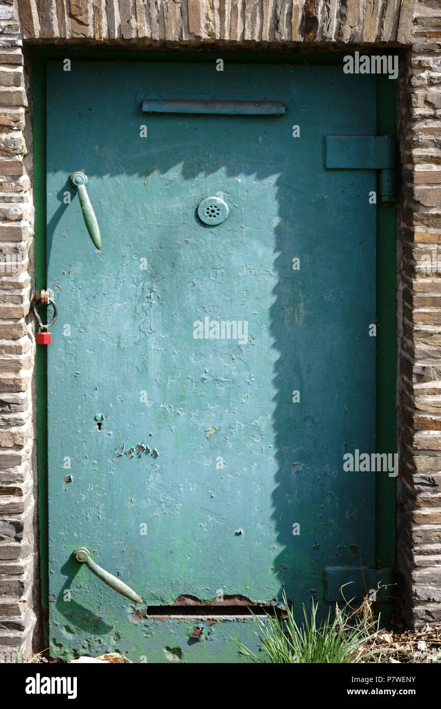 The heavy steel door and fireproof door of a bunker. Stock Photo