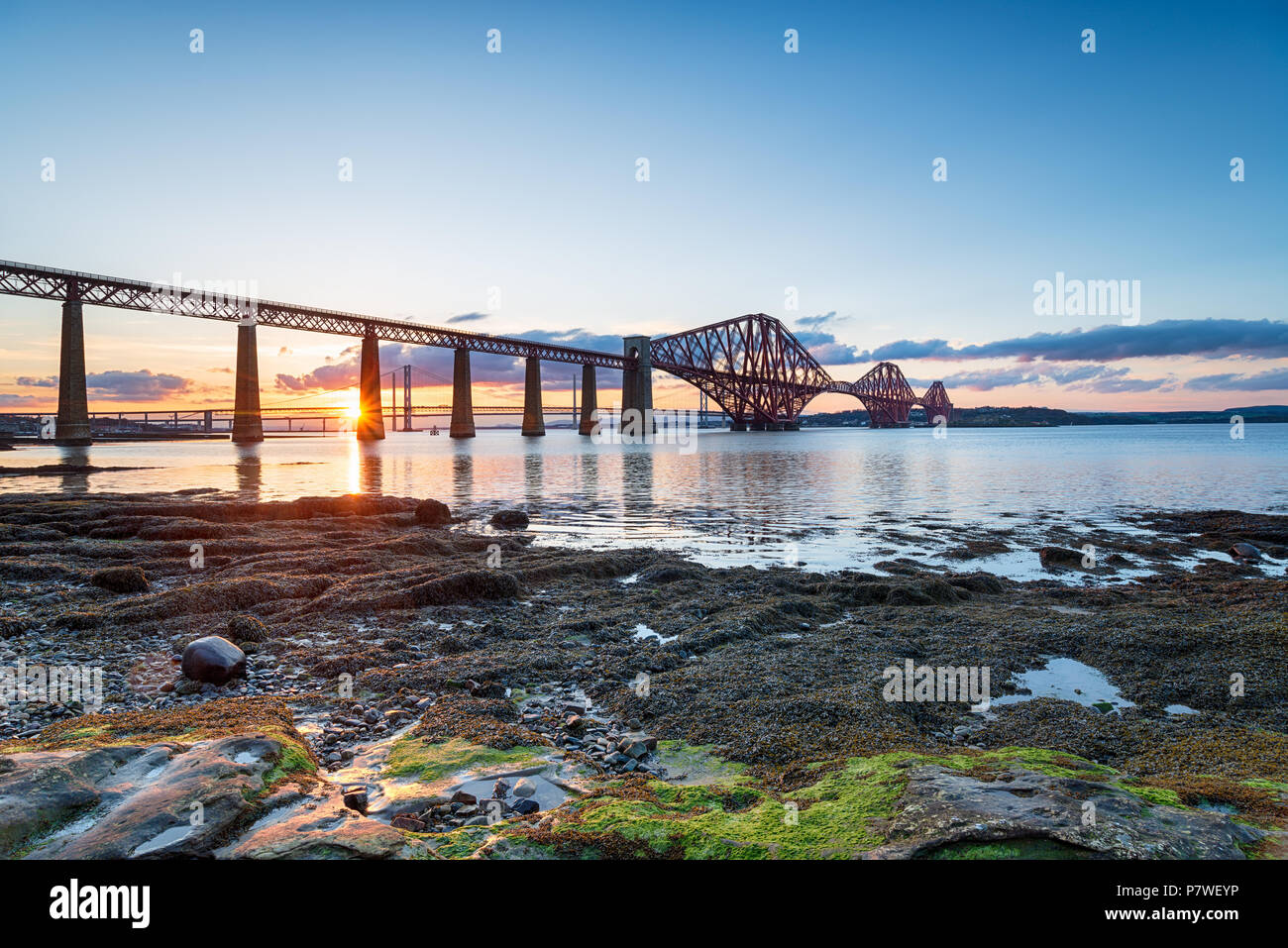 Sunset over the Forth Bridge from Queensferry near Edinburgh in Scotland Stock Photo