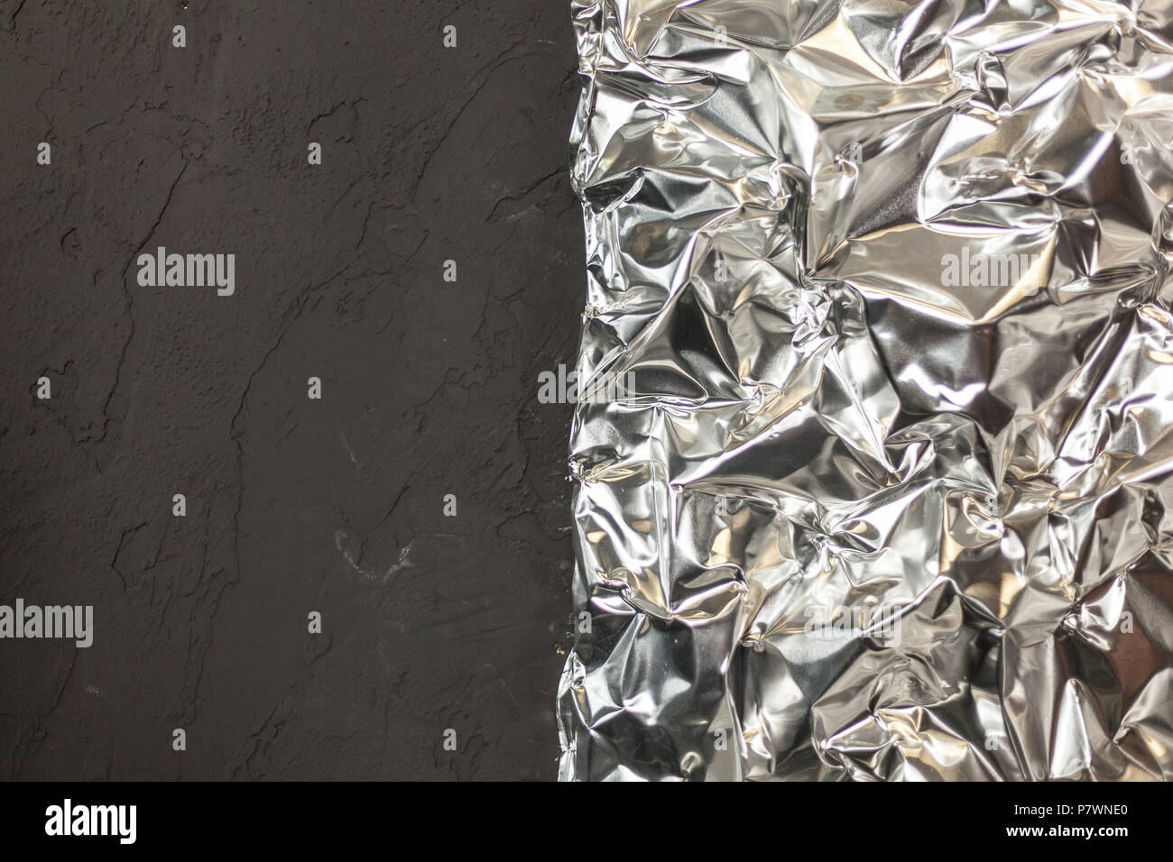 https://c8.alamy.com/comp/P7WNE0/full-frame-take-of-a-sheet-of-crumpled-silver-aluminum-foil-background-P7WNE0.jpg