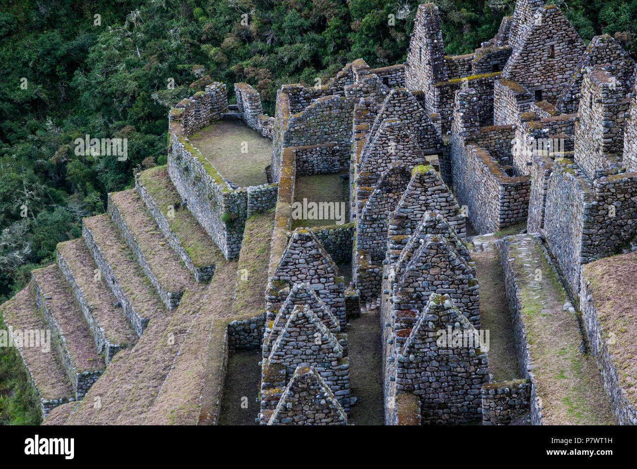 Ancient stone ruins of an Inca town on the Inca Trail in the Andes ...