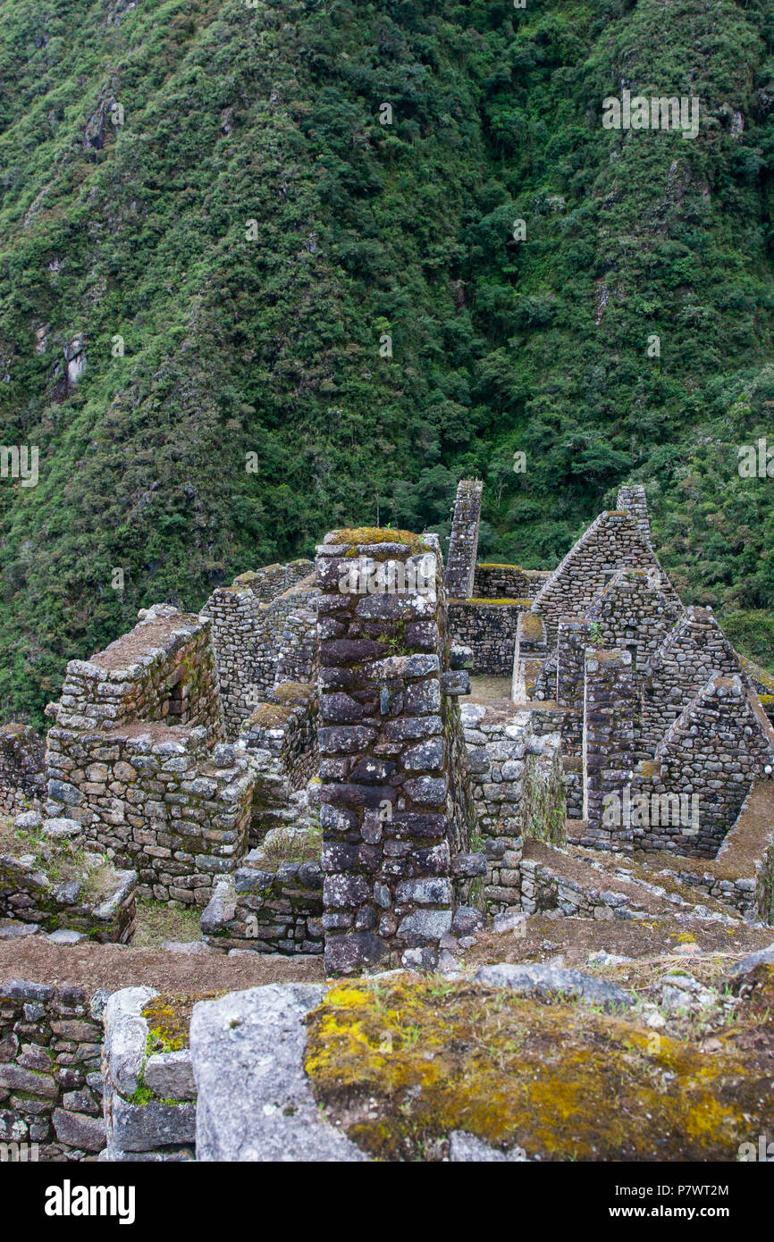 Ancient stone ruins of an Inca town on the Inca Trail in the Andes ...