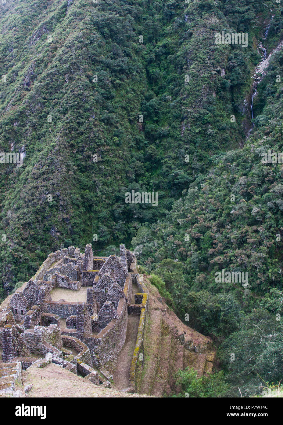 Ancient stone ruins of an Inca town on the Inca Trail in the Andes ...