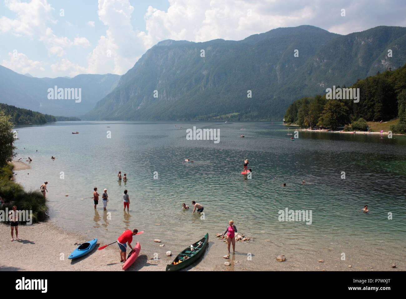 People enjoying the water at Lake Bohinj, Slovenia, Europe, in summer Stock Photo
