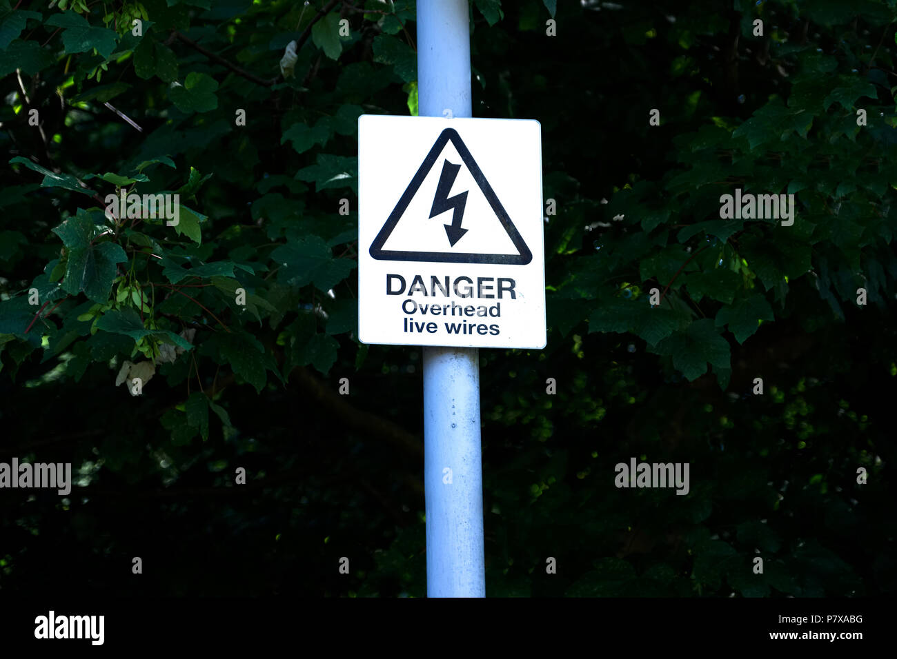 Danger of death overhead live cables electricity can kill Stock Photo