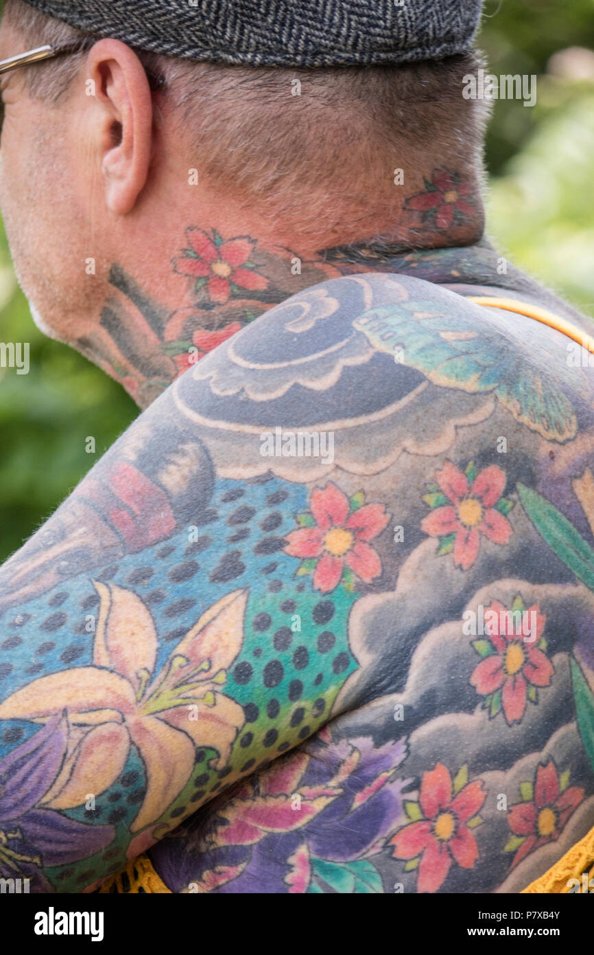 Middle aged man with Japanese flower pattern tattoos, England, UK Stock Photo
