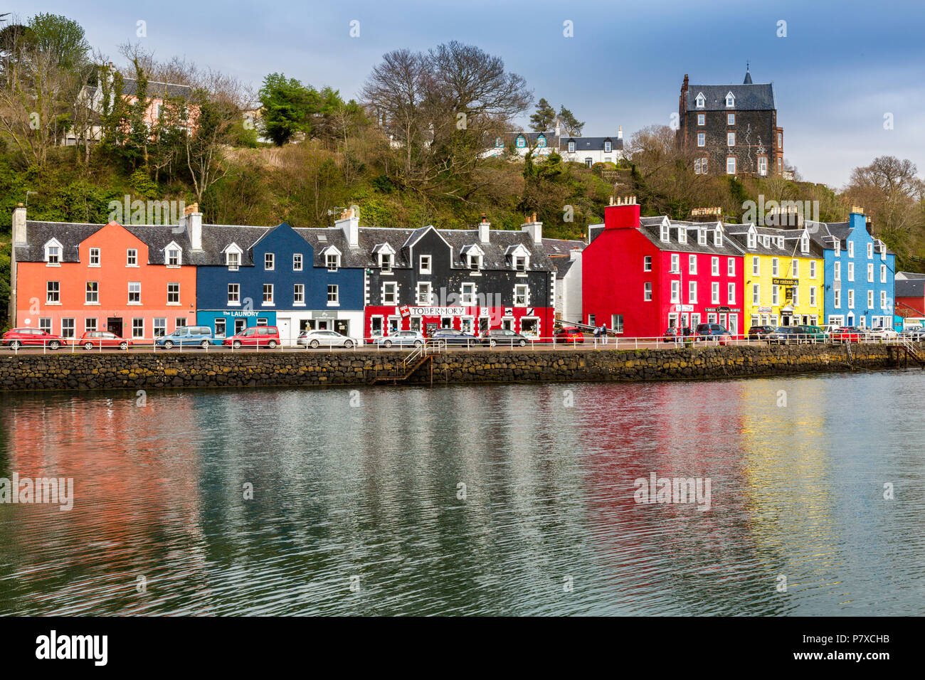 Colourful shops, bars, restaurants, hotels and houses line the historic harbour in Tobermory, Isle of Mull, Argyll and Bute, Scotland, UK Stock Photo