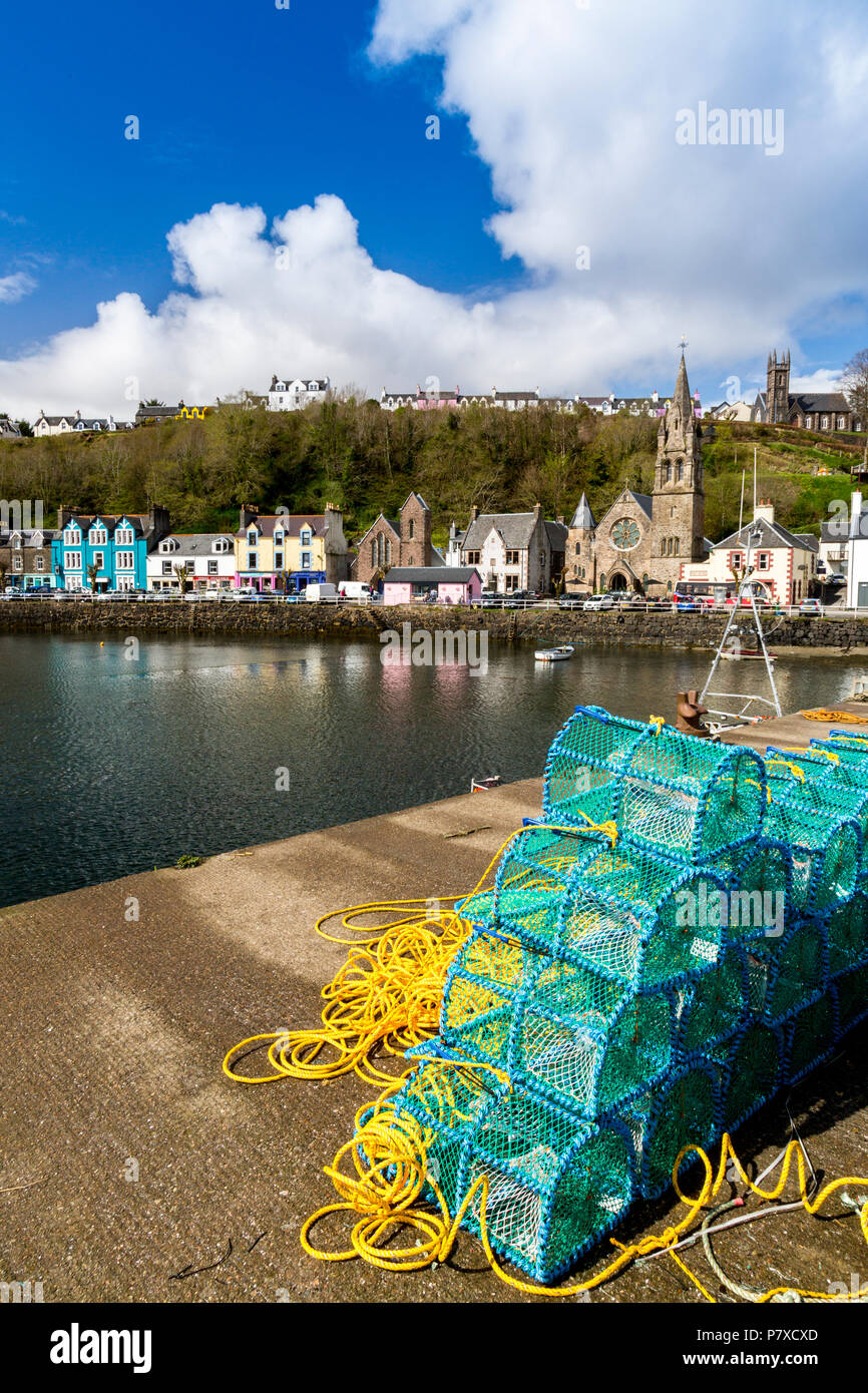 A stack of colourful new lobster creels on the harbour wall in Tobermory, Isle of Mull, Argyll and Bute, Scotland, UK Stock Photo