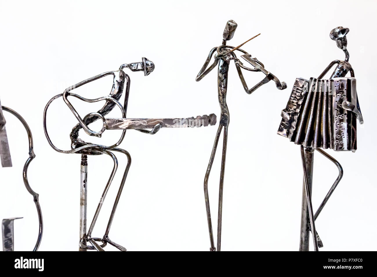 Figures of music performers made with welded black metal wire. Guitar