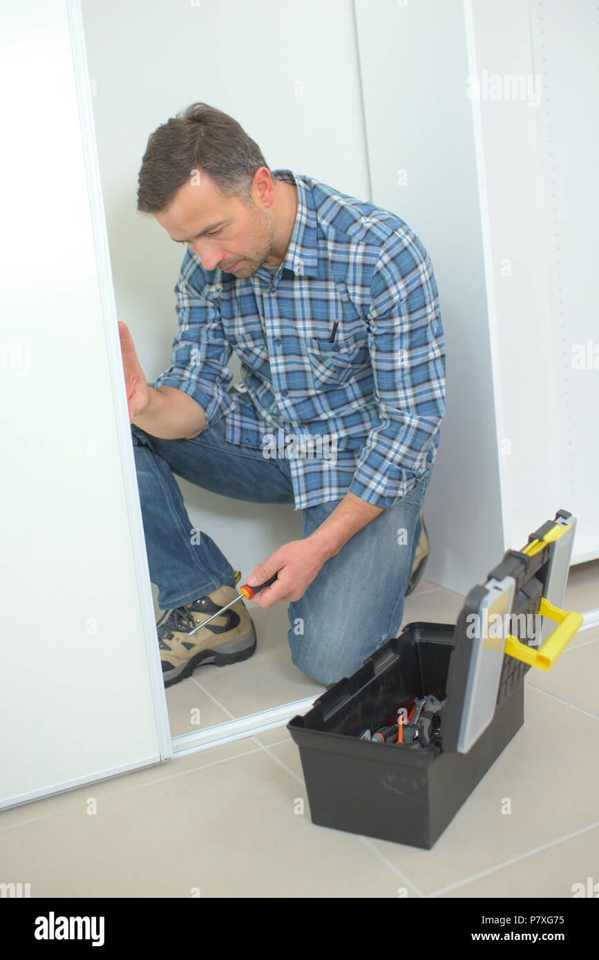 Man Assembling Wardrobe Stock Photo 211410505 Alamy