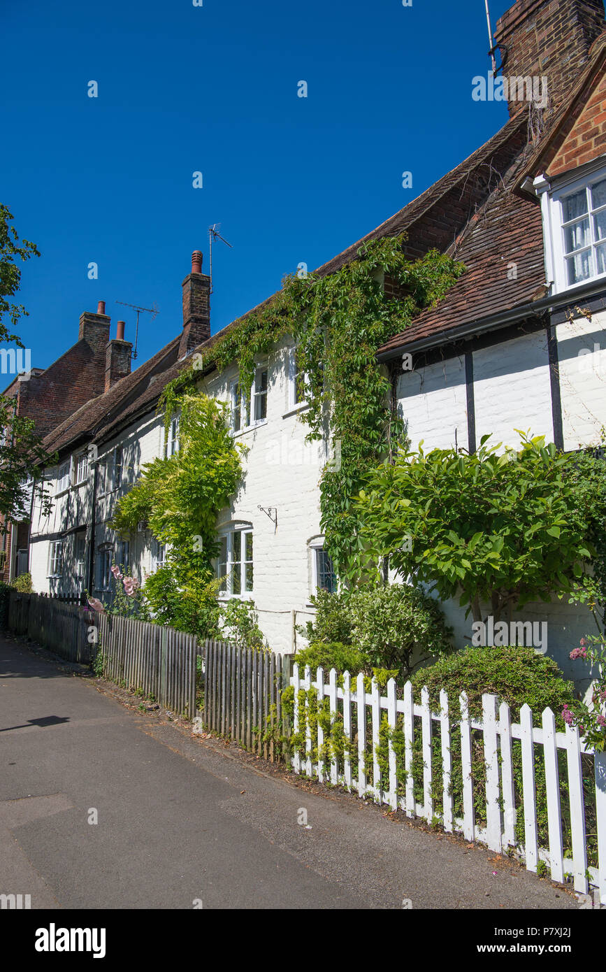 Old cottages with white picket garden fences, High Street, Wendover, Buckinghamshire, England, UK Stock Photo