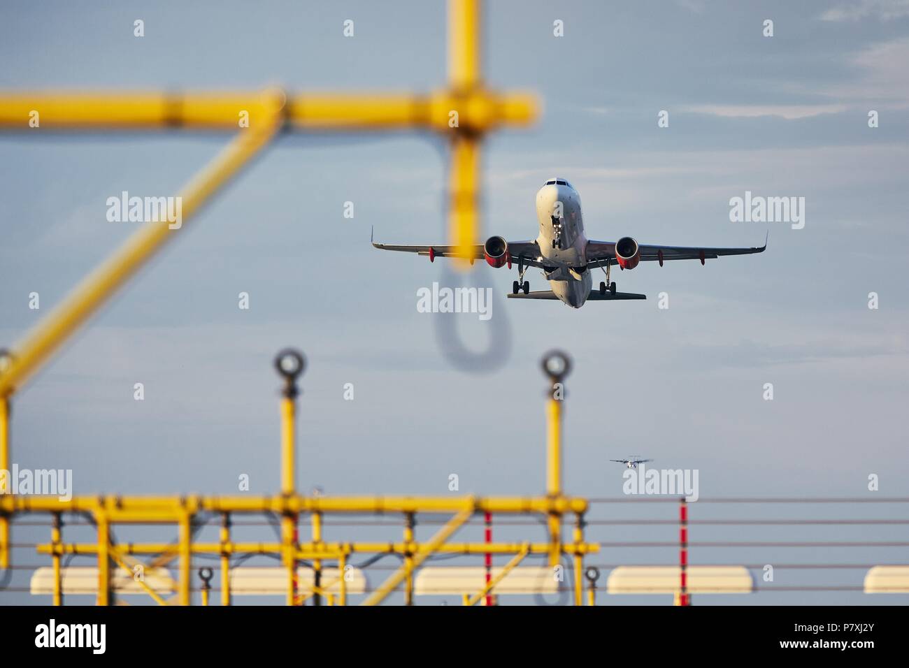 Traffic at the airport. Low angle view of the airplane during take off