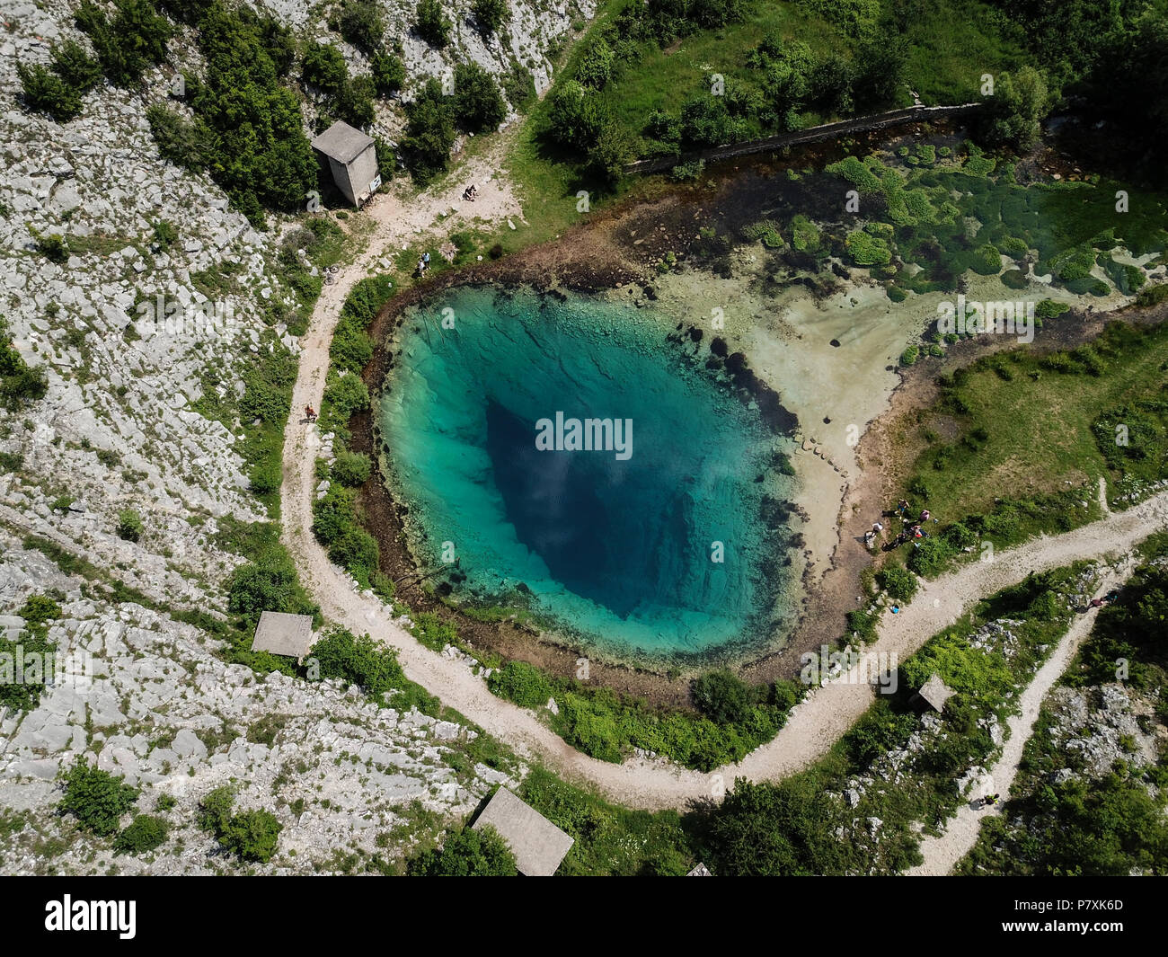 The spring of the Cetina River (izvor Cetine) in the foothills of the Dinara Mountain is named Blue Eye (Modro oko). Stock Photo