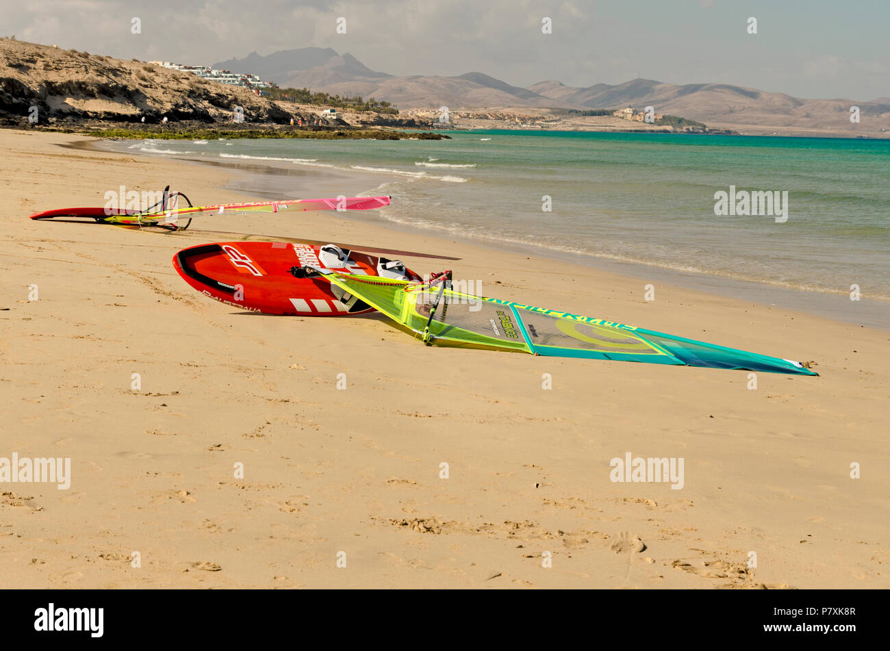 Sotavento beach, Fuerteventura, Canary Islands, Spain: May 26th, 2018. Windsurfing boards lying in the sand on Sotavento beach at low tide Stock Photo