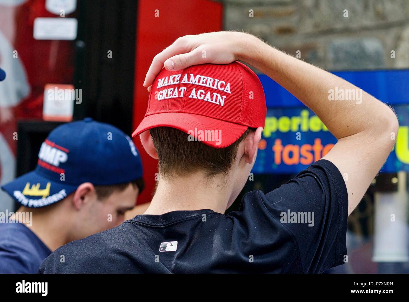 Washington, DC - October 6, 2017: Two young men display their support for President Trump through the MAGA hats they are wearing at the National Zoo. Stock Photo