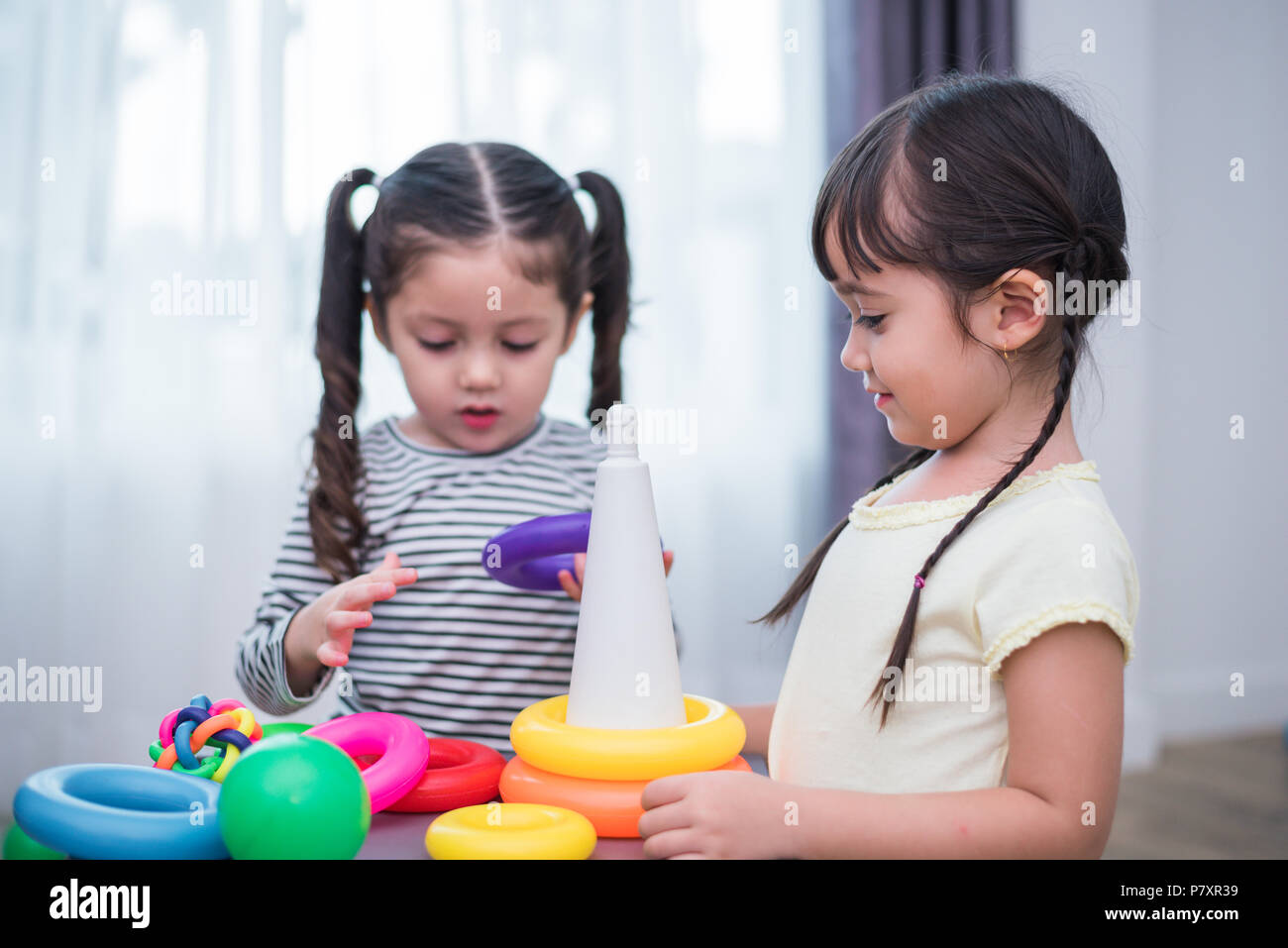 little girls playing with toys
