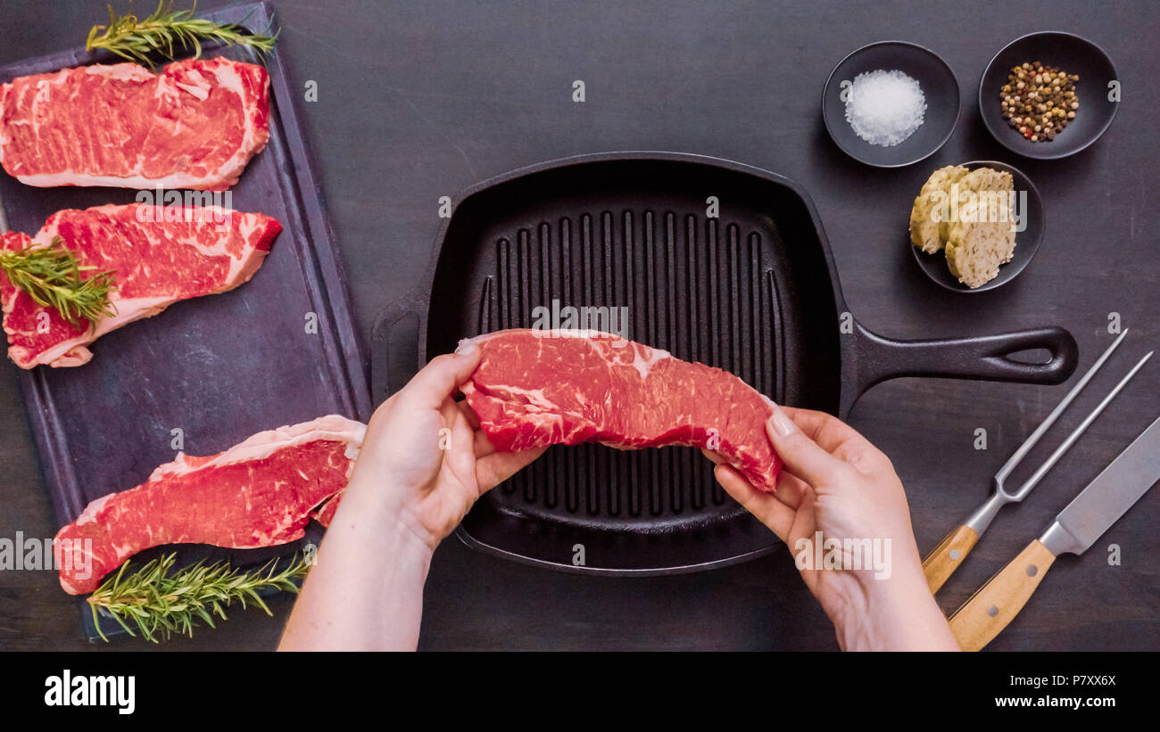 Raw New York strip steaks in cast iron frying pan Stock Photo Alamy