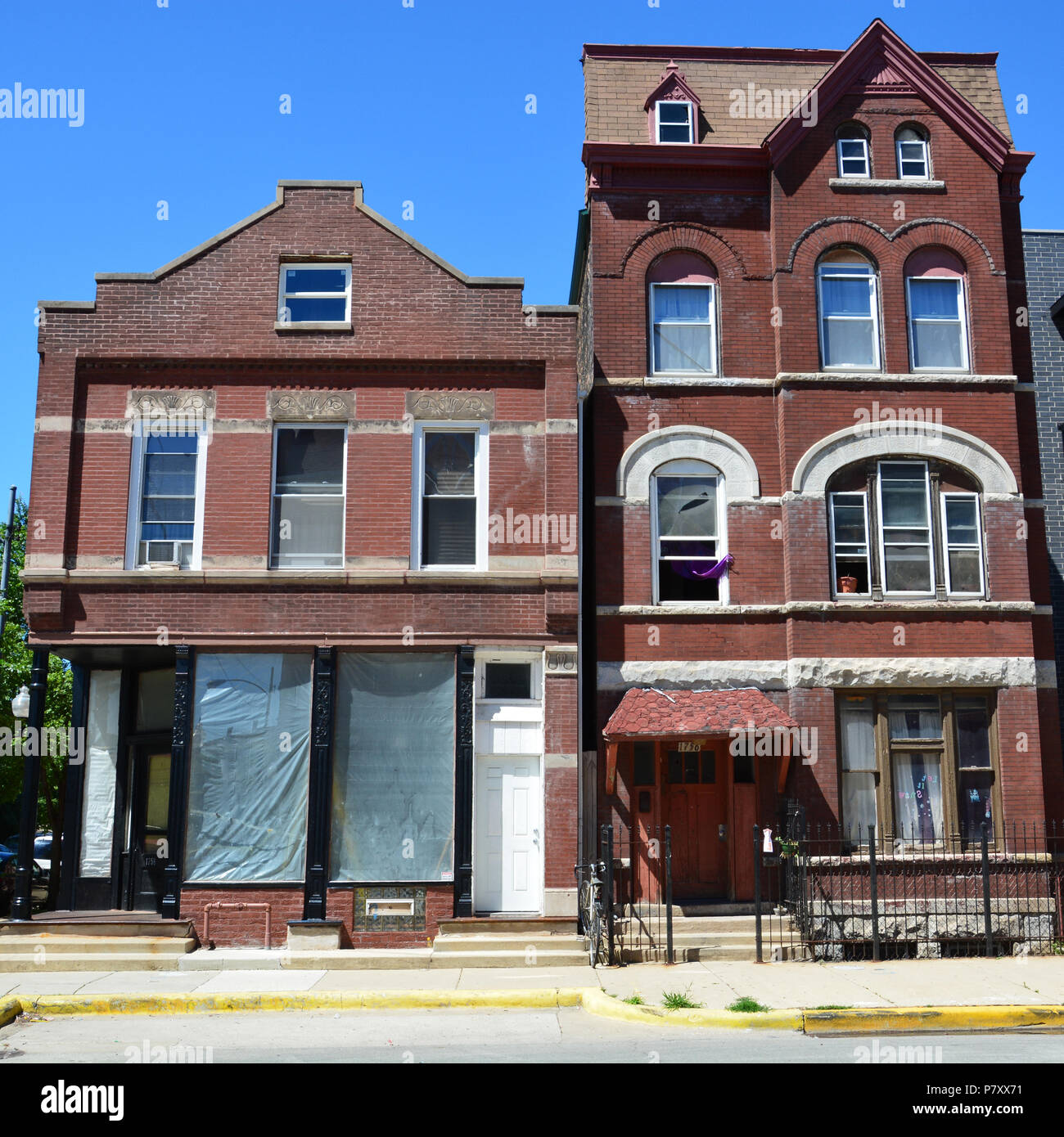 Tightly stacked turn of the century apartment buildings along 18th