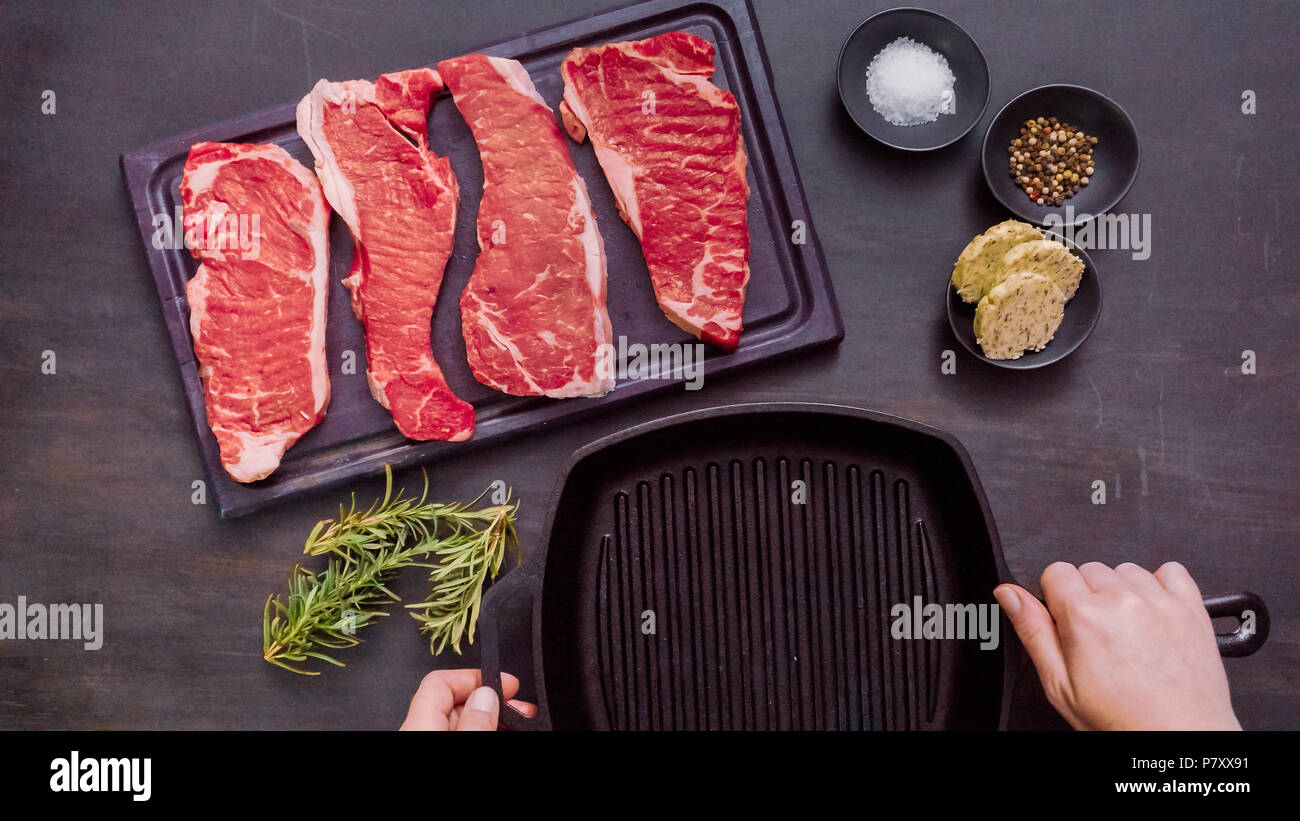 Raw New York strip steaks in cast iron frying pan Stock Photo Alamy