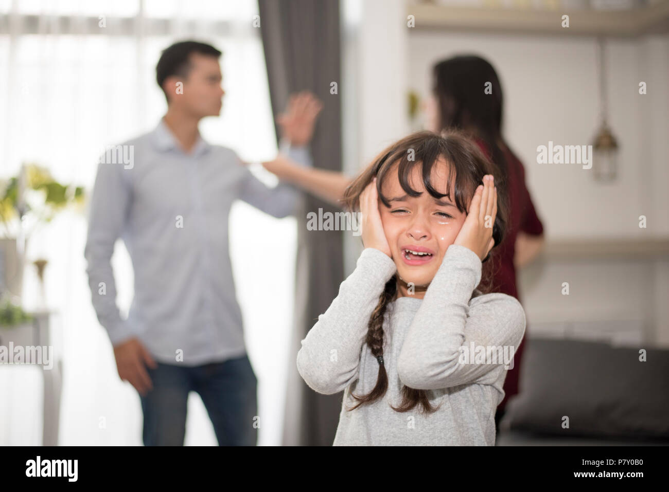 Little girl was crying because dad and mom quarrel, Sad and dramatic ...