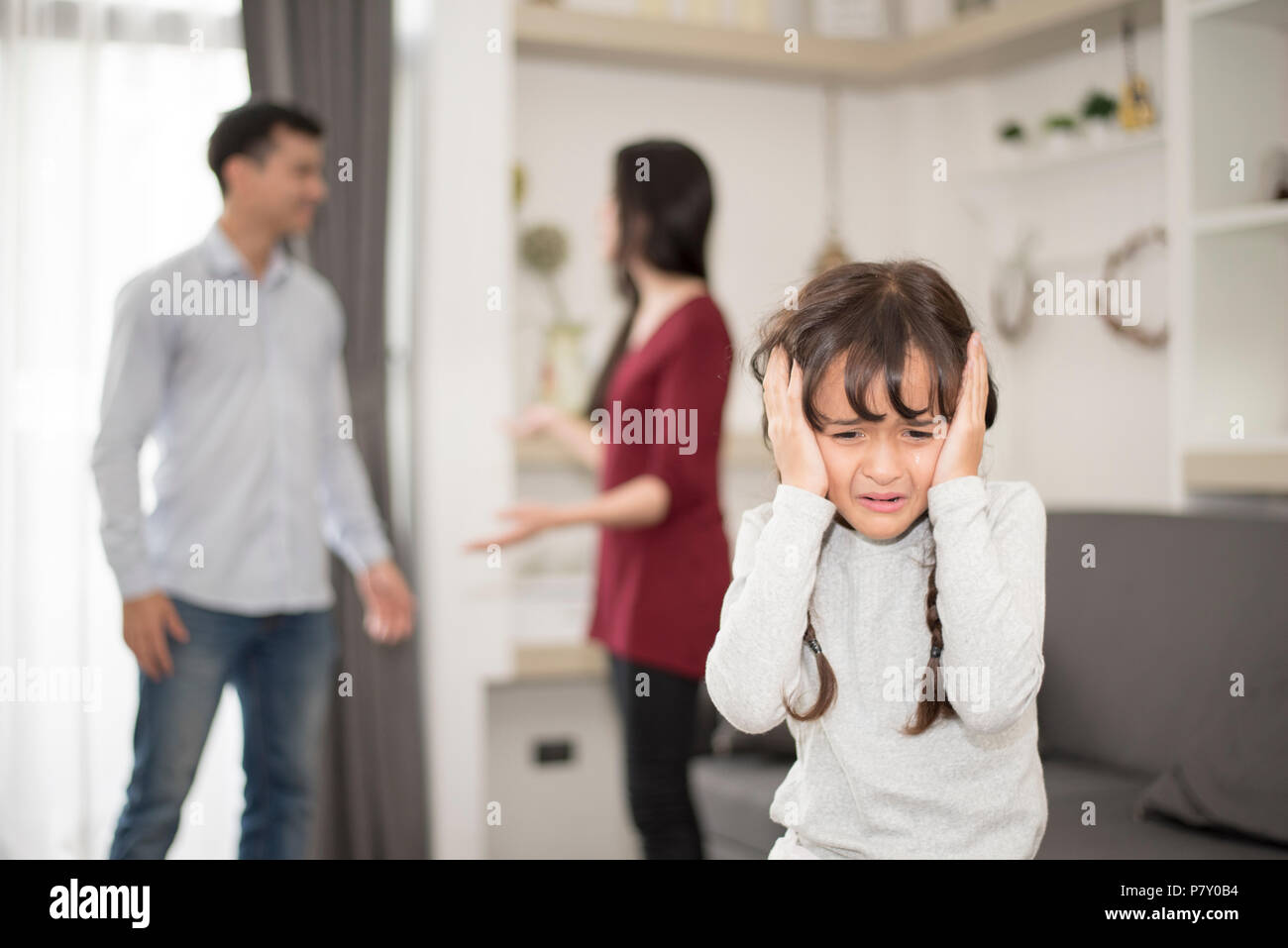 Little girl was crying because dad and mom quarrel, Sad and dramatic ...