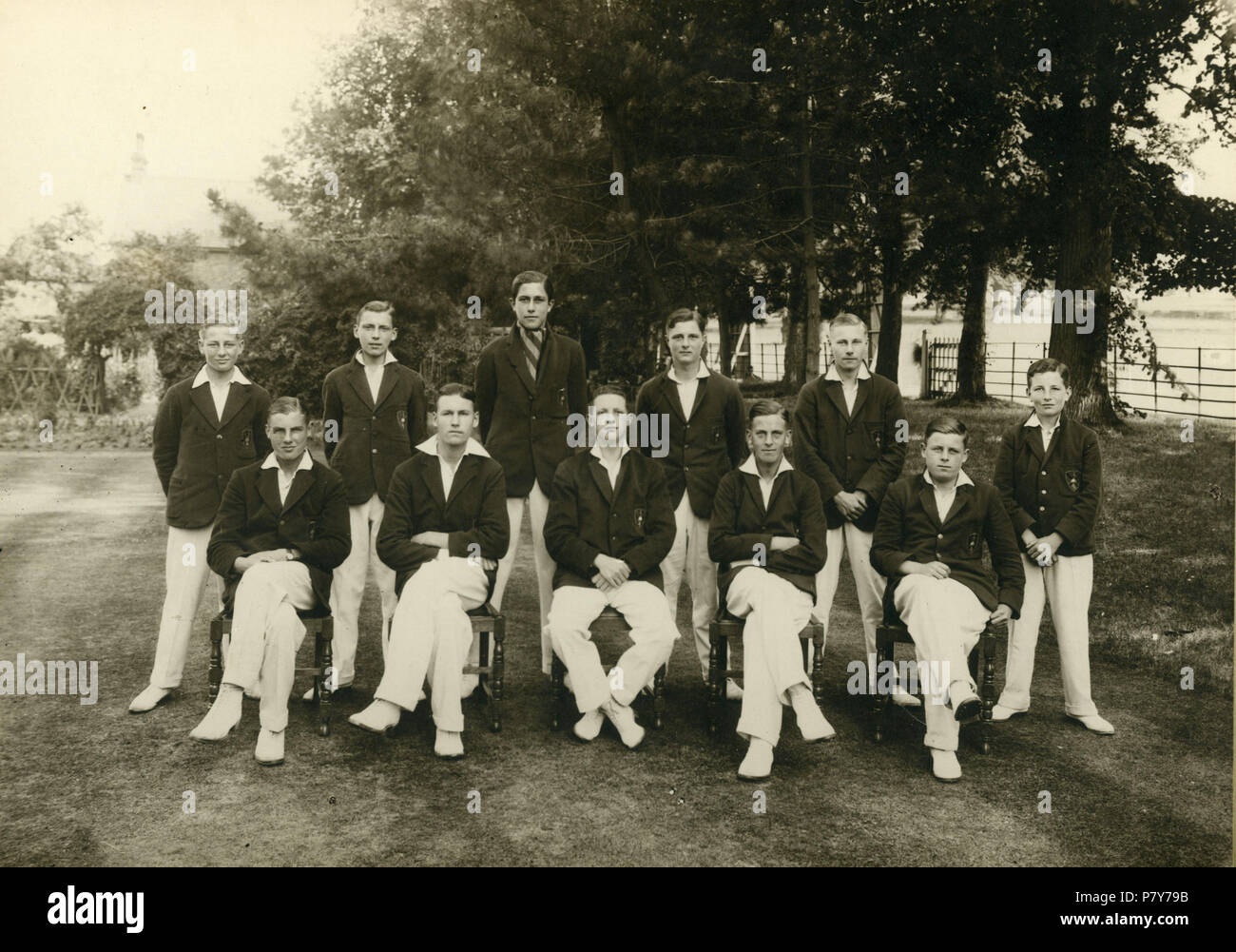 Group portrait of cricket team aged perhaps 16-18yrs at Herne Bay College, Herne Bay, Kent, England. The portrait is larger than A4 size, mounted on a large card. At the top of the card it says 'Herne Bay College second team 1929' with the coat of arms showing the Kentish white horse symbol, the Herne Bay heron symbol and an open book. The motto is Delectando Pariterque monendo. Below the photo on the card is the list of names. Back row, left to right: D.M. Ball, W.H. Bailey, C. Alonso, B. Clemow, K.A. Lundberg, J.D. Turner. Front row, left to right; A.D. Newbury, A.J.C. Bell, L.G.L. Cooke, J. Stock Photo
