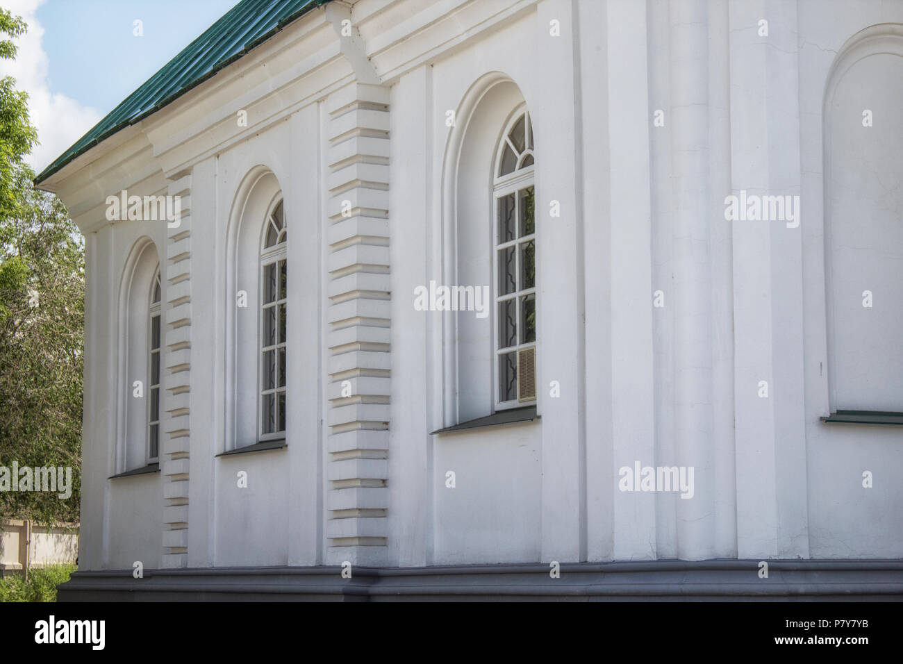 A fragment of the classical style old building. White building. Stock Photo