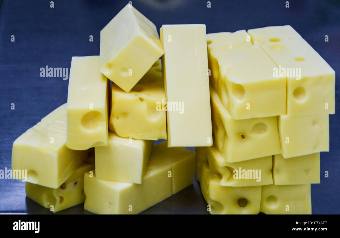 Close up of blocks of emmental cheese for cooking inside a commercial restaurant kitchen Stock Photo