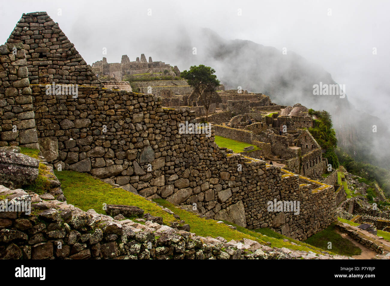 Clouds behind ancient walls of Machu Picchu Stock Photo - Alamy