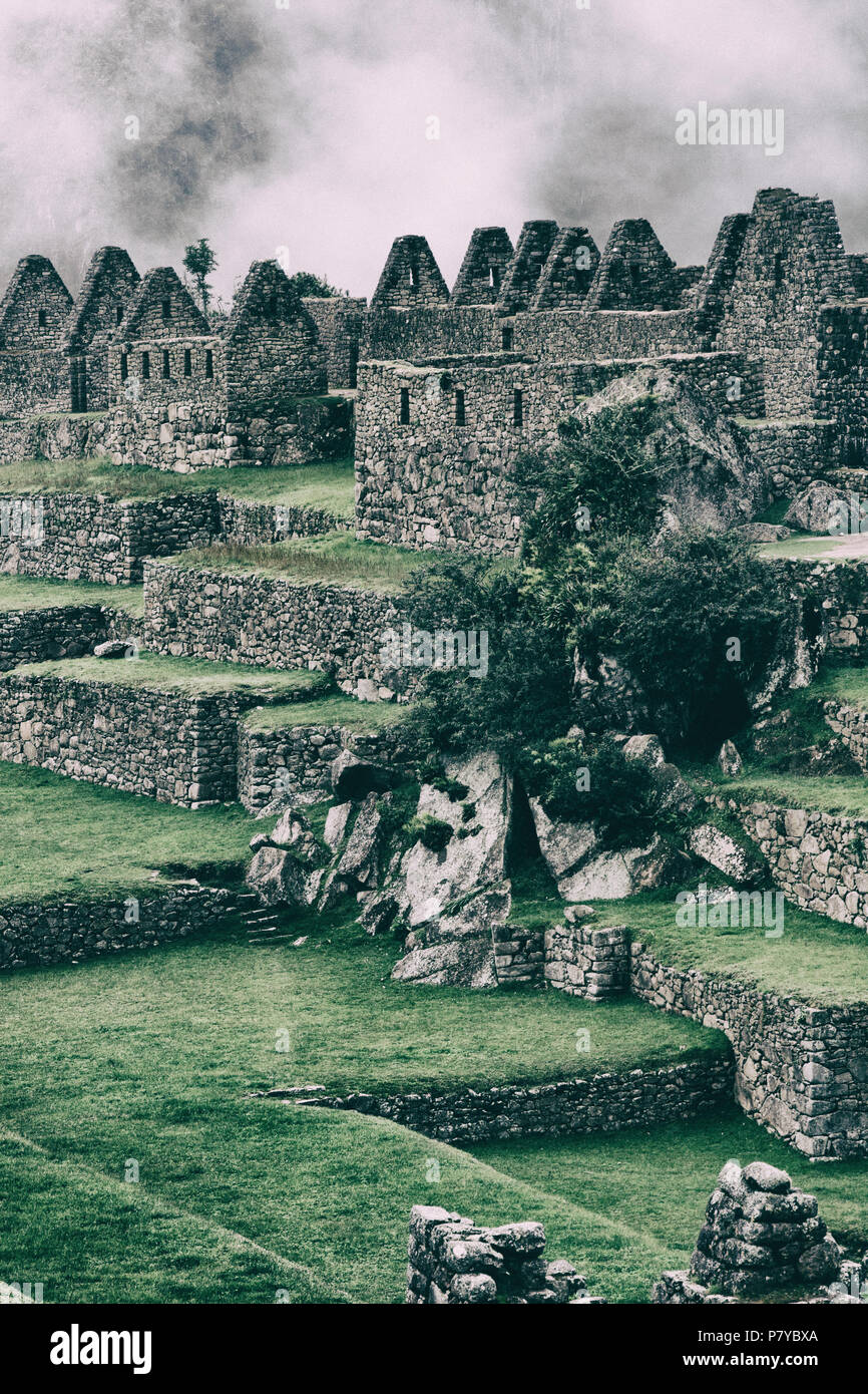 Clouds behind Machu Picchu stone ruins and nature Stock Photo - Alamy