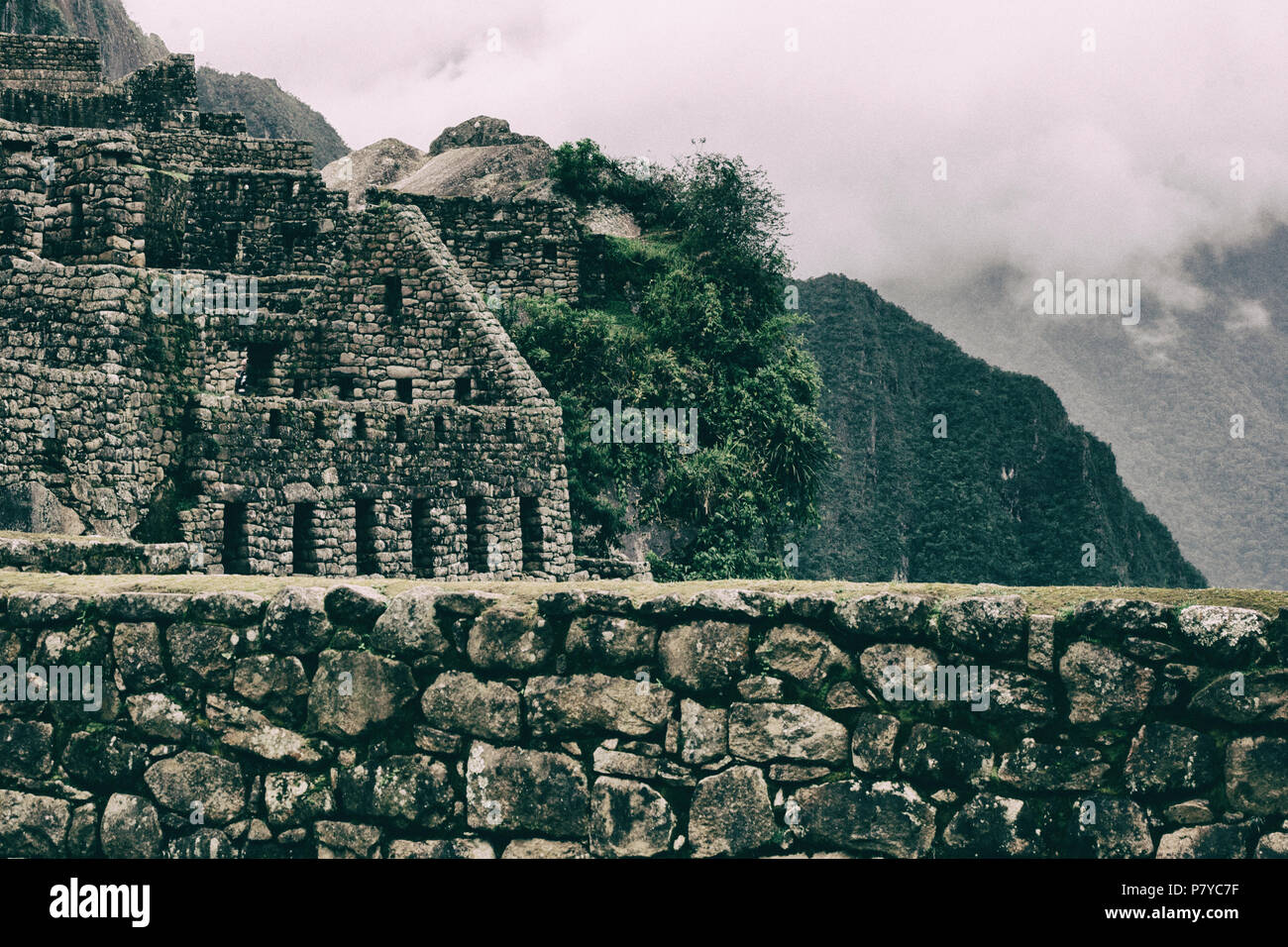 Beautiful view of Inca ancient ruins on a cliff Stock Photo - Alamy