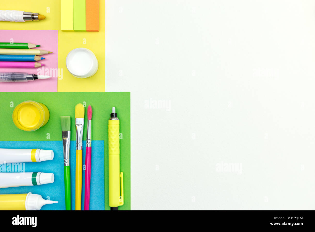 pencils, highlighters, brushes, erasers and colored album paper on