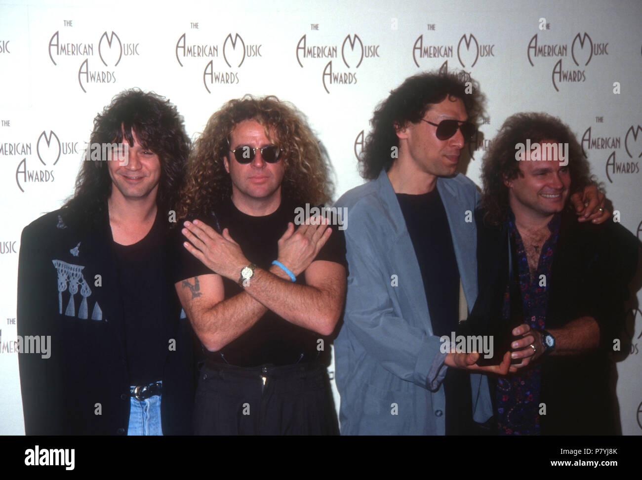 LOS ANGELES, CA - JANUARY 27: (L-R) Musicians Eddie Van Halen, Sammy Hagar,  Alex Van Halen and Michael Anthony of Van Halen attend the 19th American  Music Awards on January 27, 1992