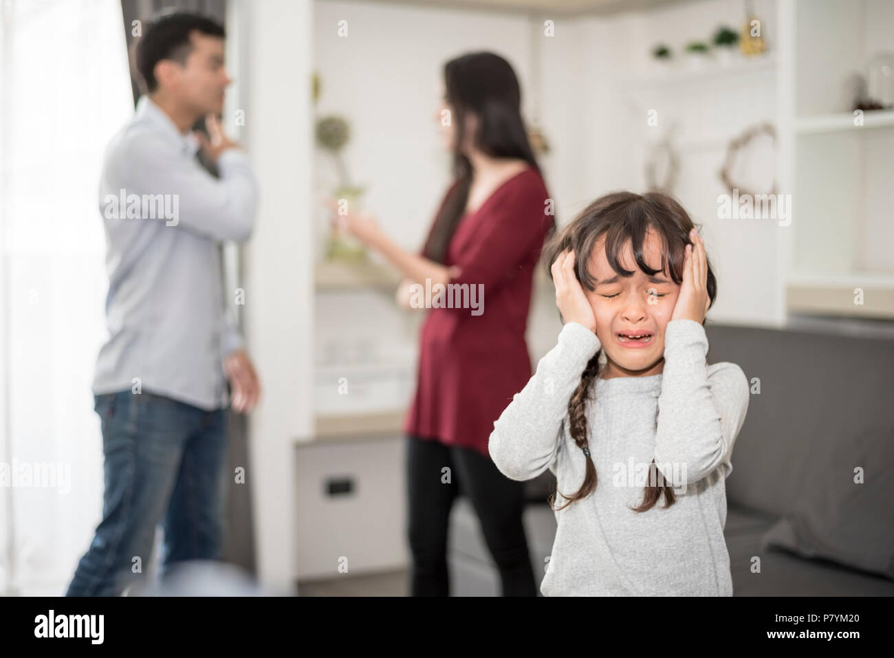 Little girl was crying because dad and mom quarrel, Sad and dramatic ...