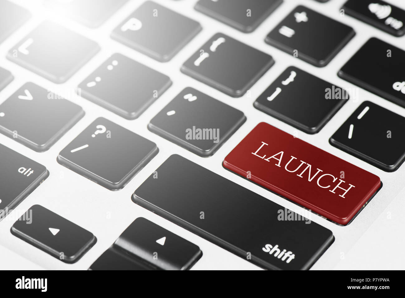 "LAUNCH" Red button keyboard on laptop computer for Business and Technology concept Stock Photo