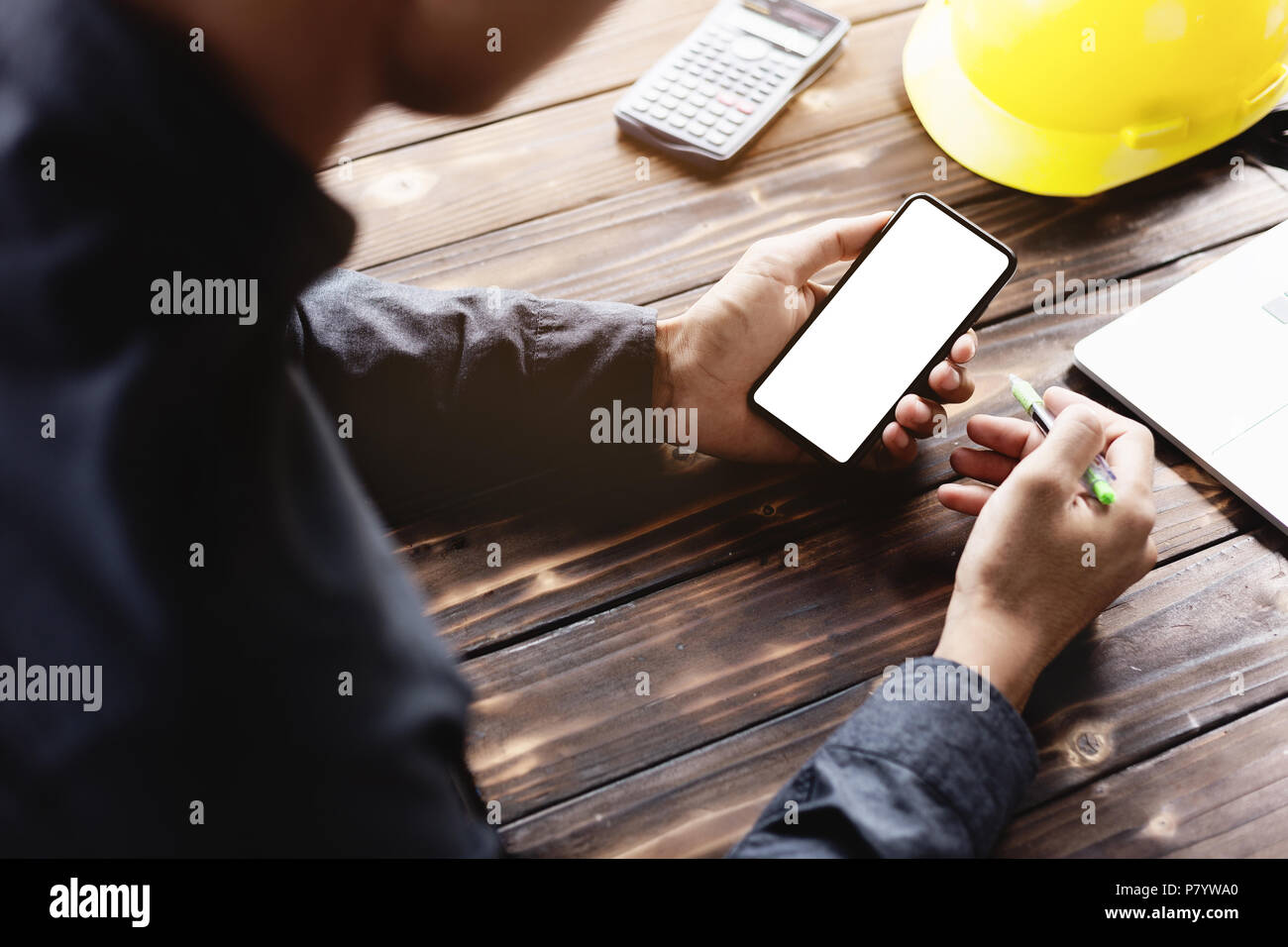 engineering using phone mobile on desk Stock Photo Alamy