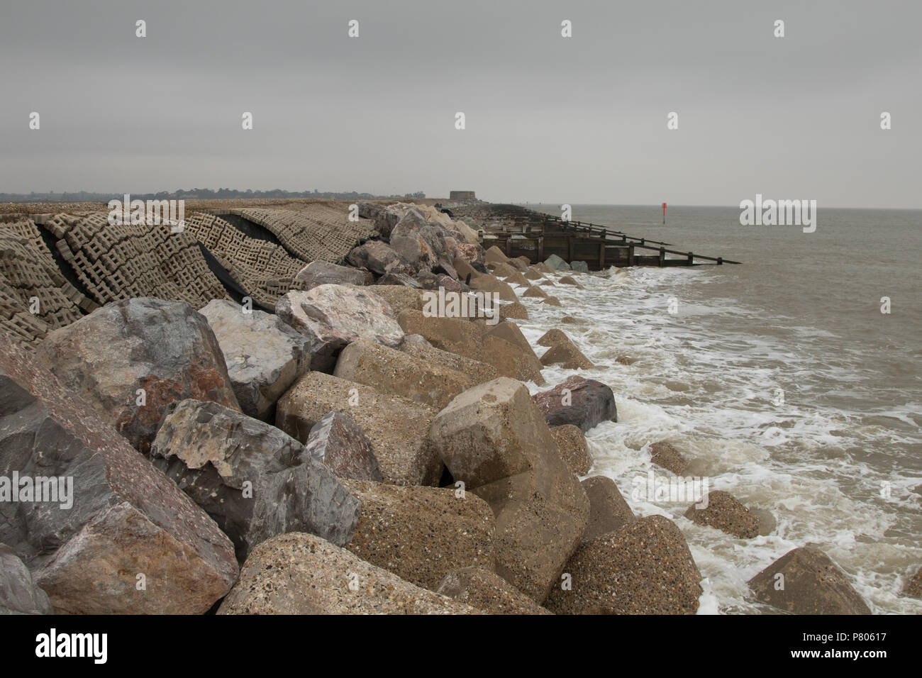 The sea defences and coastal erosion on the spit separating the River ...