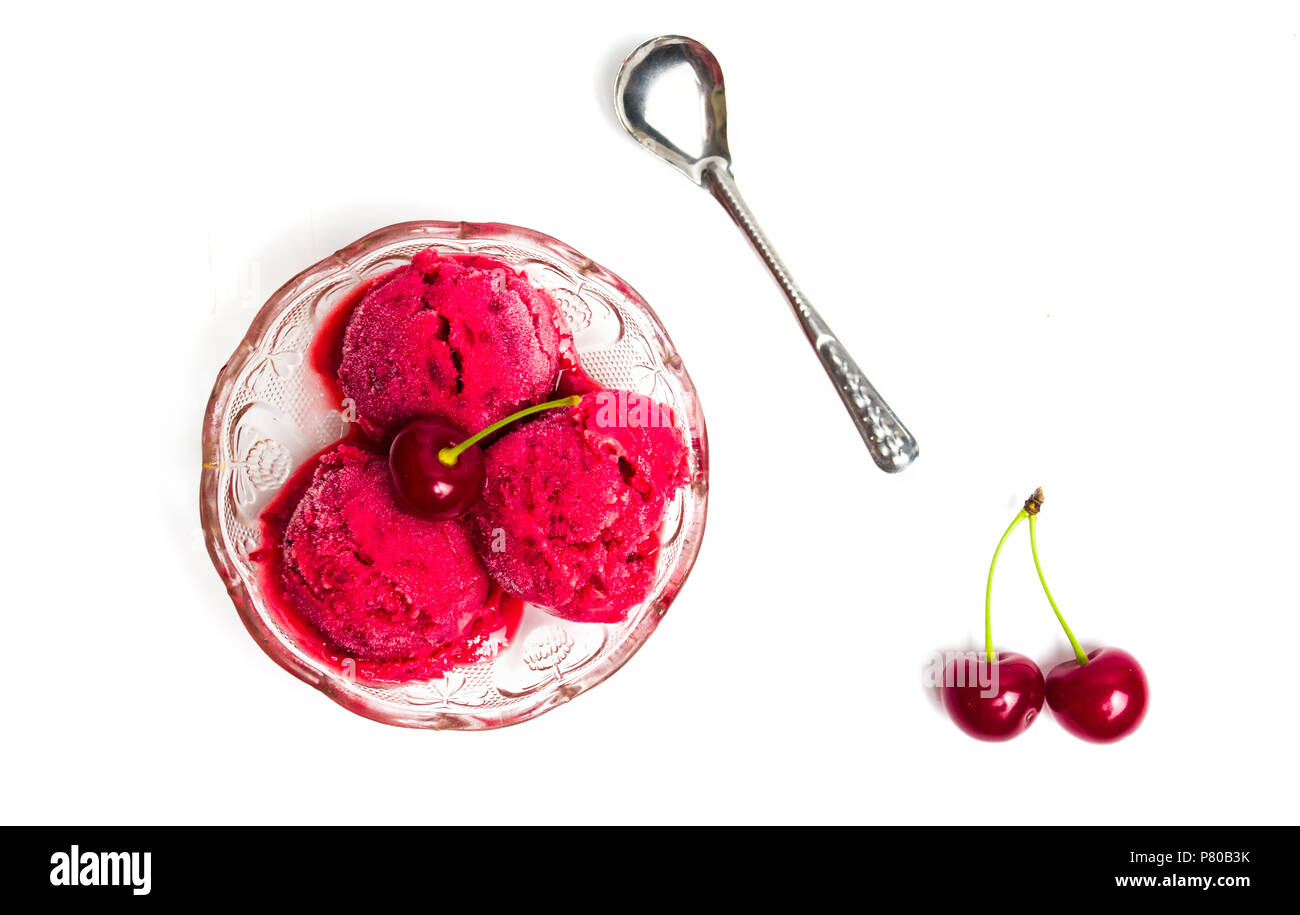 Cherry ice cream scoops in a bowl on white Stock Photo
