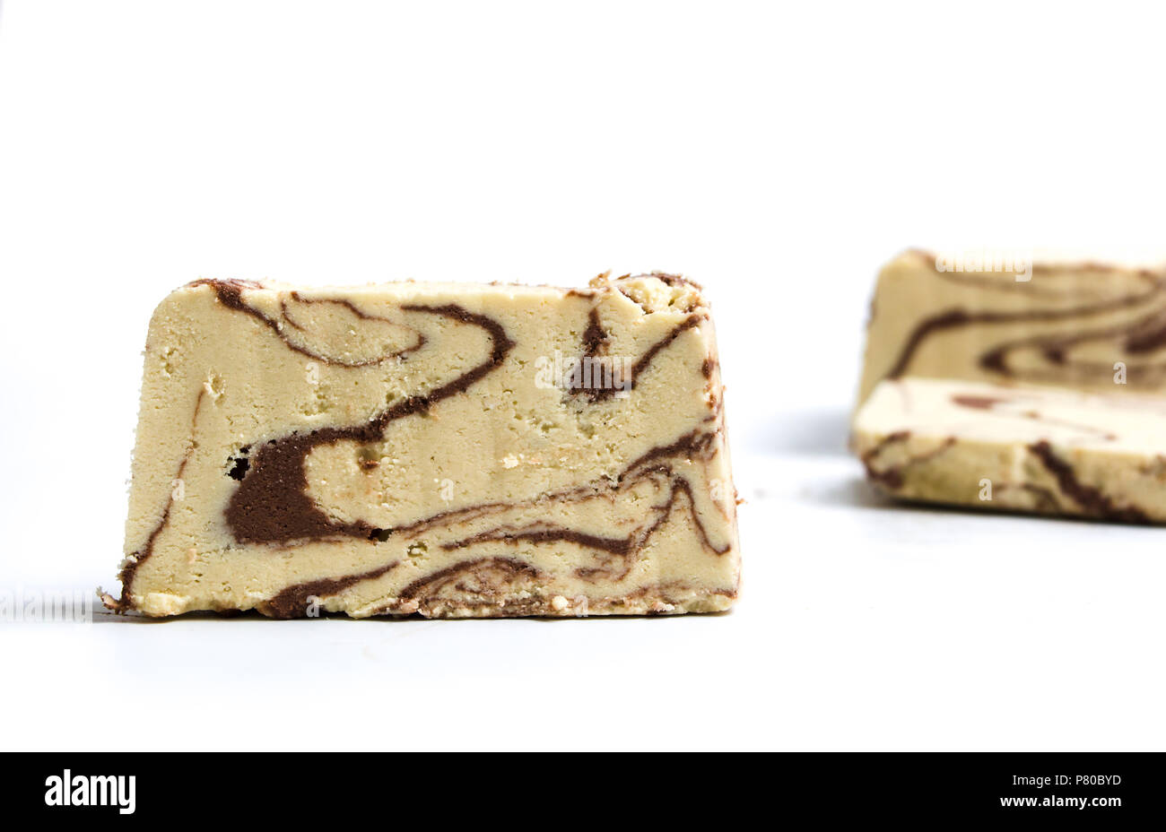 Halva with cacao pieces on white background Stock Photo