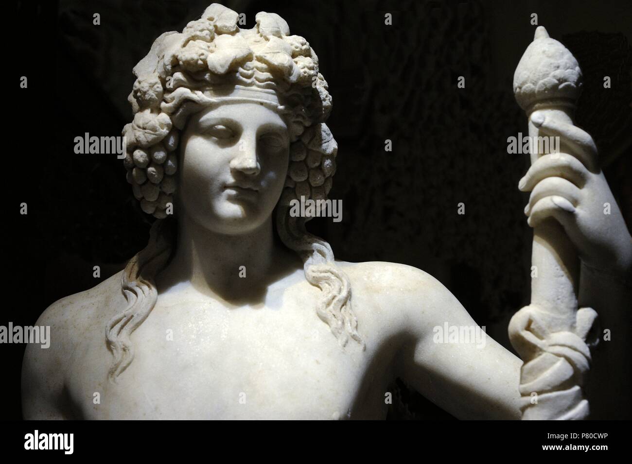 Statue of Dionysus, God of Wine, with crown of grape clusters. Detail. 1st century AD. Marble. National Archaeological Museum. Naples. Italy. Stock Photo