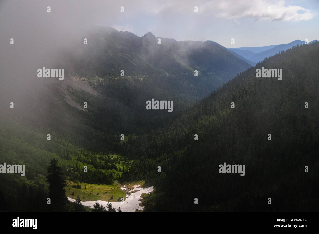 Mount Rainier shrouded in Clouds Stock Photo - Alamy