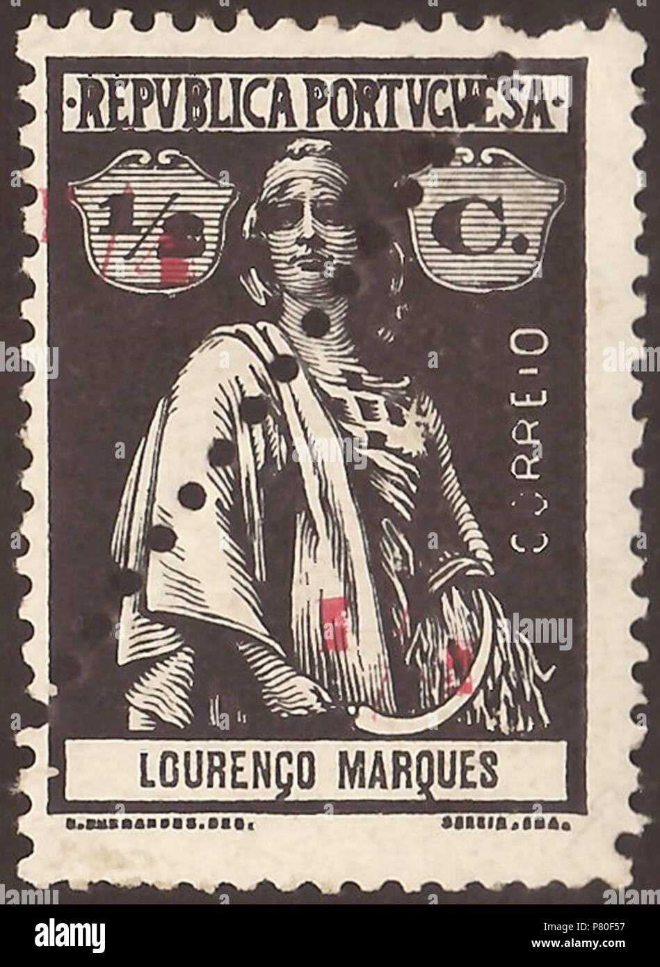 Stamp (pair) of Lourenço Marques (Portuguese Mozambique); 1915; definitive overprint stamp of the issue 'Ceres - colonial issues' from 1914 divided in two parts by diagonal perforation from left below to right top and with a red overprint of a new value in each of the both triangle halfs; mint stamp Stamp: Michel: No. 147 (= Michel No. 118 with division and red overprints) Color: black / black (undivided) with red overprint on 'reaper-coated' paper in each half (Note: In the anglophone literature is sometime used the term 'reaper-coated' as description for the paper of these stamps without to  Stock Photo