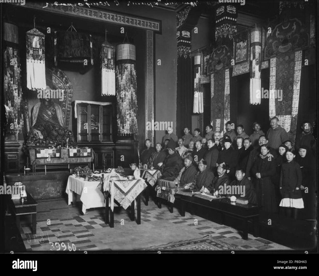 English: People praying in a Buddhist temple in St. Petersburg :      - . 1915 308 People praying in a Buddhist temple in St. Petersburg Stock Photo