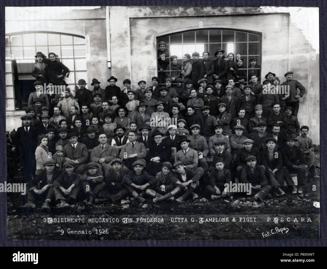 . Italiano: Ditta G. Camplone & Figli, fotografia di gruppo, Pescara 1926 . Italiano: Fotografia di gruppo dei dirigenti e degli operai della fonderia Camplone, scattata dal fotografo C. Pepe, Pescara 9 gennaio 1926. In seconda fila sono riconoscibili da sinistra: l'ing. Corradino D'Ascanio, l'imprenditore Giuseppe Camplone e i suoi fratelli (AS Pescara, Archivio privato D'Ascanio Corradino, b. 2, fasc. 41, n. 1) . 9 January 1926 134 Ditta G. Camplone &amp; Figli, fotografia di gruppo, Pescara 1926 - san dl SAN IMG-00003398 Stock Photo