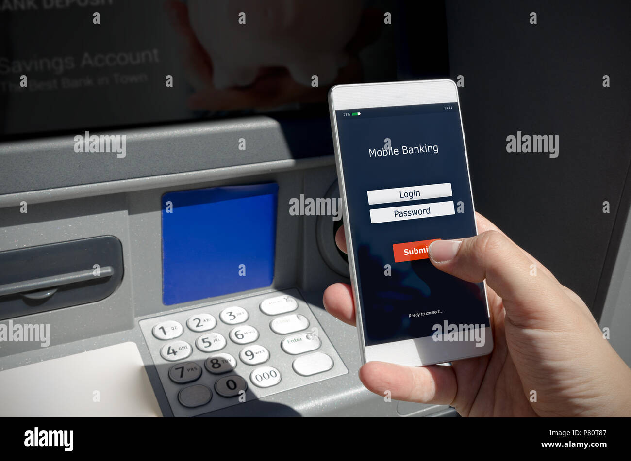 Withdraw money from an ATM without using a credit card. Person holding a phone with a login screen for mobile banking. Stock Photo